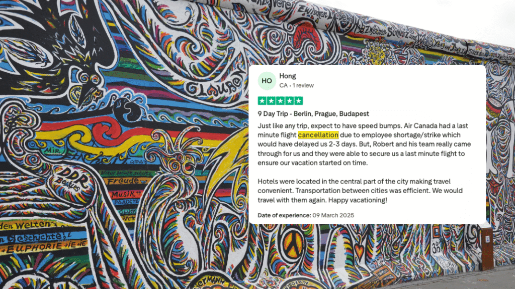 A colourful mural on the Berlin Wall with a positive customer review about Orbis Travels’ excellent handling of unexpected flight cancellations.